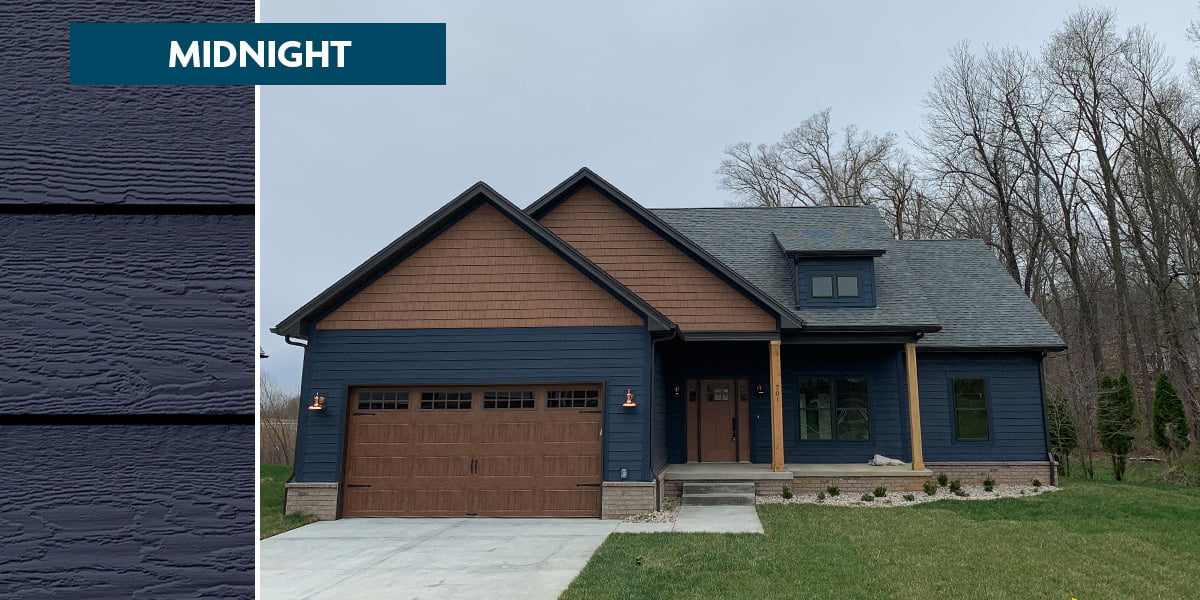 midnight blue siding color on new construction home with natural wood accents