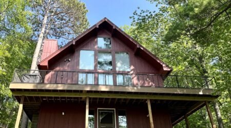 red siding color, board and batten, cabin style home