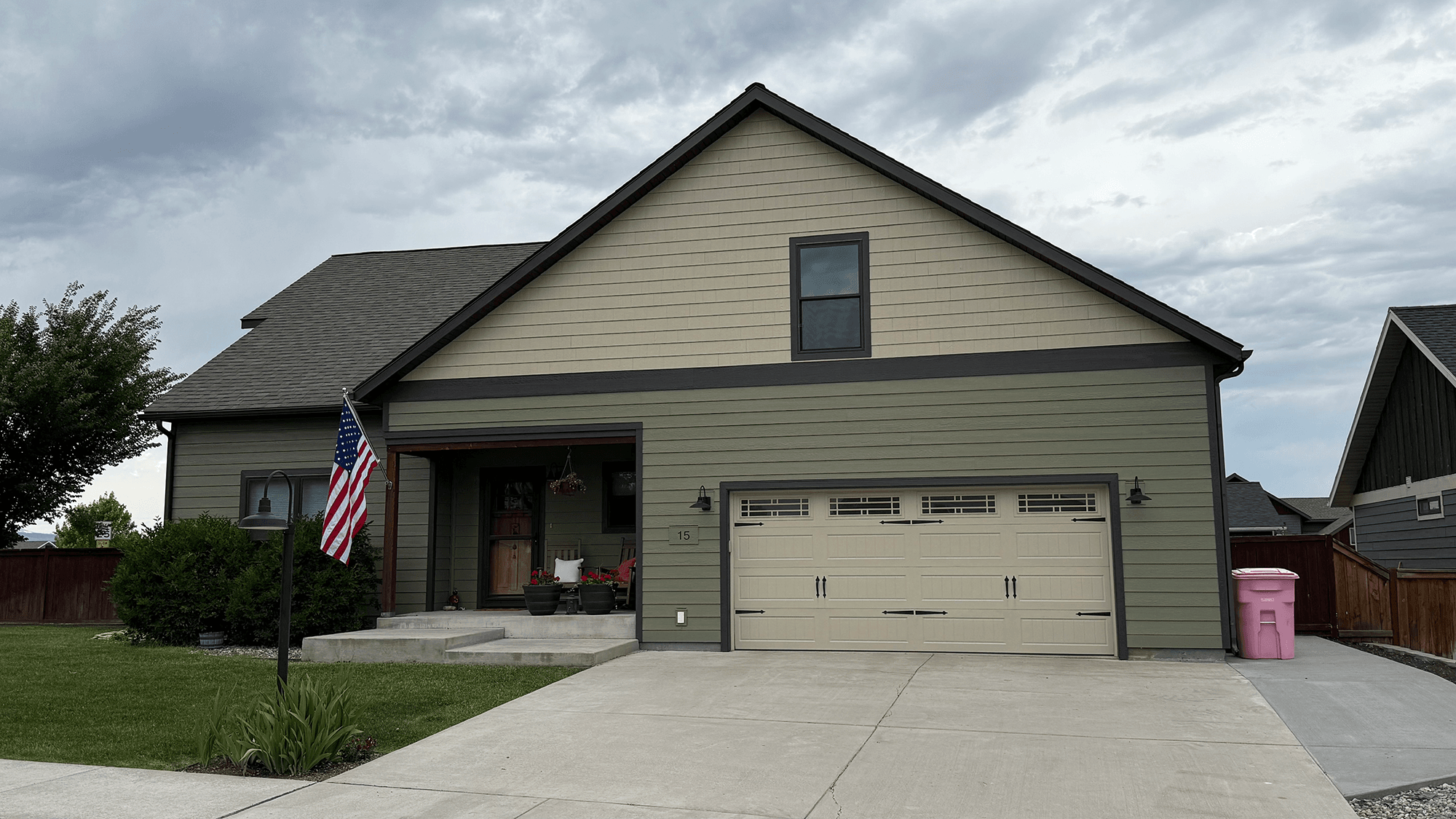 Traditional home style with Olive green Lap siding with Sand Straight Edge Shake Siding